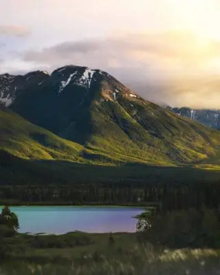 Mountain at sunset with a lake below